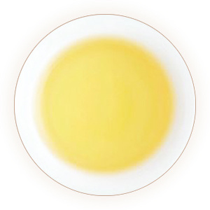 A cup of pale yellow tea liquor